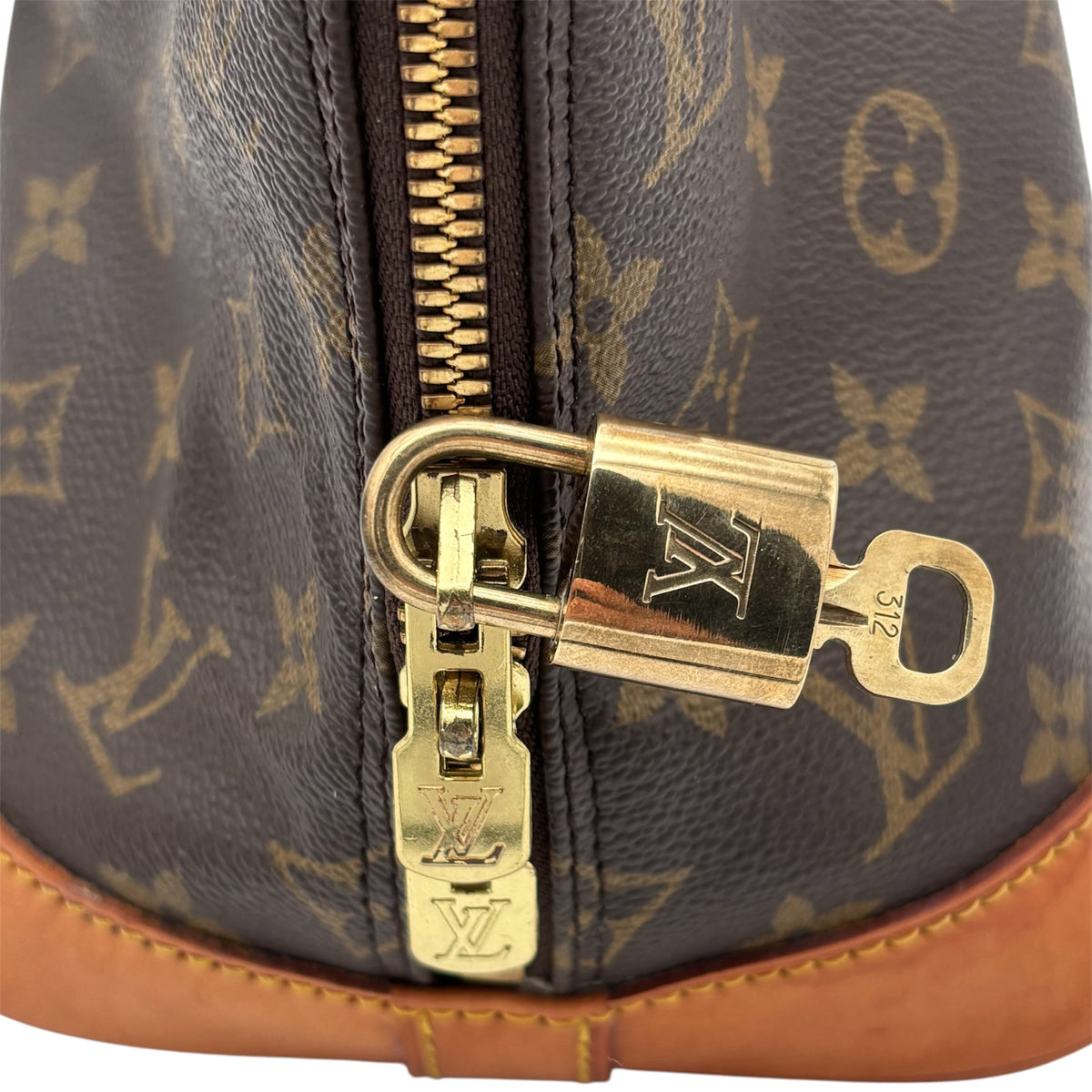 Cadenas et clé d'origine Louis Vuitton de l'Alma PM, zips gravés LV